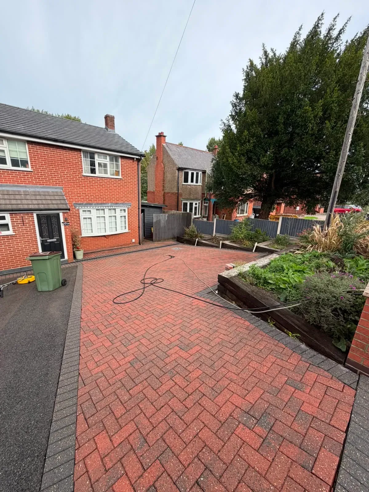 Cleaned block-paved driveway at a completed Midland Revive job in Thringstone.